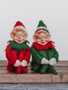 Dvije figure božićnih viljenaka zelene i crvene boje